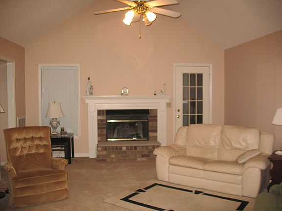 Vaulted ceiling and fireplace.