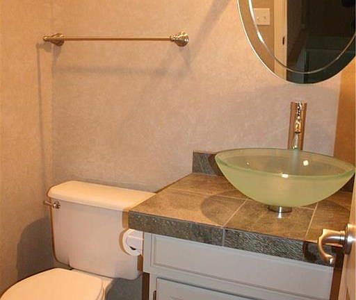 Half bath with slat flooring