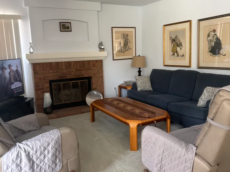 The family room is open to the kitchen yet separated by a half wall.
