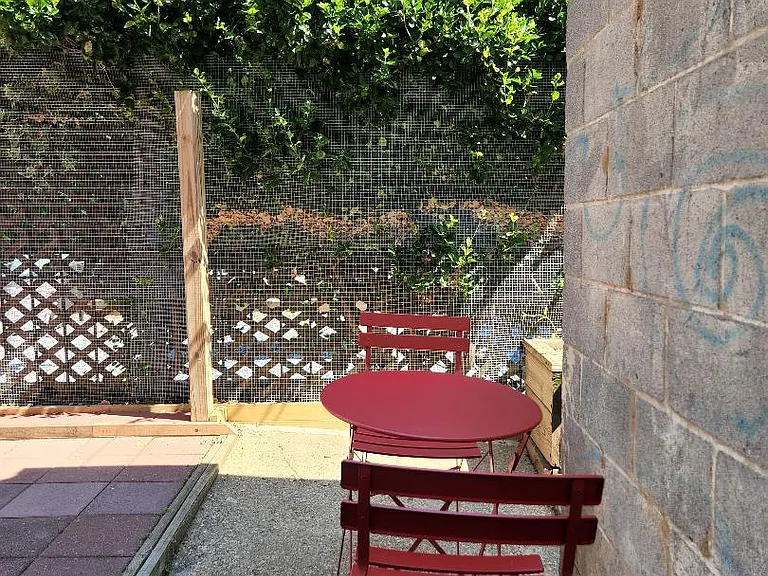 Outside bistro seating on sunny day.