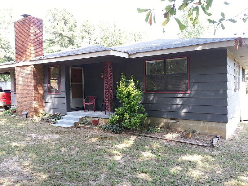 Shaded Front Porch
						:
						Shaded by large oak in front & bordered by hot pink crepe myrtles on the north.