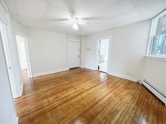 Fresh paint and gleaming hardwood floors throughout the sun drenched living spaces.