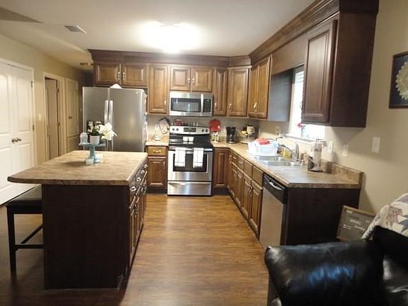 VIEW OF KITCHEN FROM DINING AREA