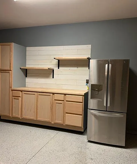 Garage area with storage and shelving.