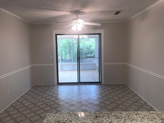 Dine-in breakfast room overlooking screen porch and backyard