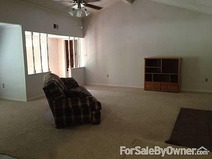 Living Room
						:
						Large room with vaulted ceiling; front door/foyer on left, foyer has oak floor