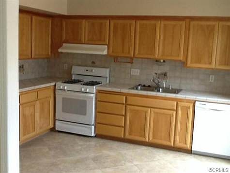 Light and bright kitchen adjacent to atrium.