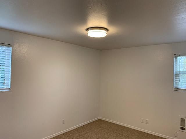 one of two front bedroom facing east and south with closet