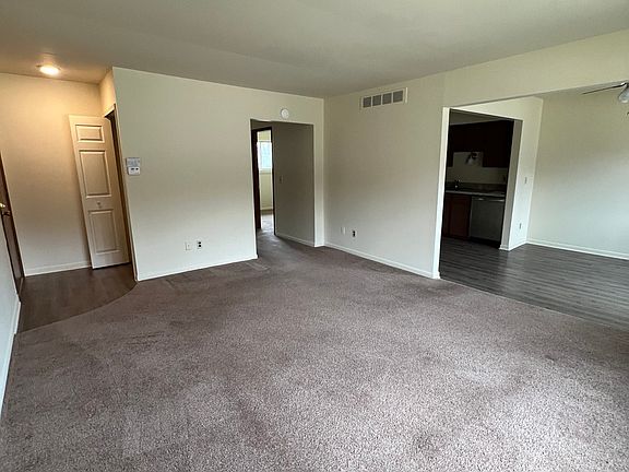 Spacious living room, dining area and front entry coat closet as seen in photo.