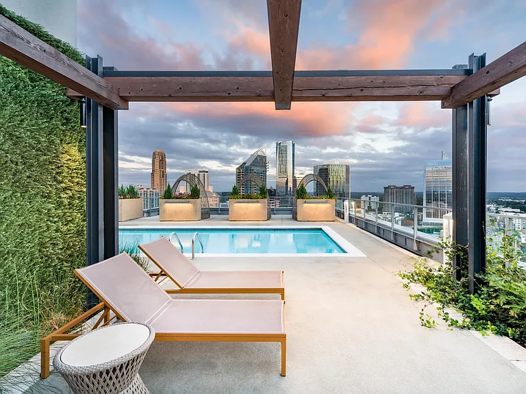 Rooftop poolside at Modera Old Ivy pairs skyline sunsets with quiet lounge seating, offering a refined retreat near Atlanta's Buckhead district.