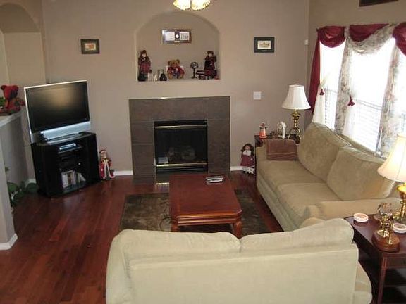 Family Room w/gas fireplace and solid hardwood flooring