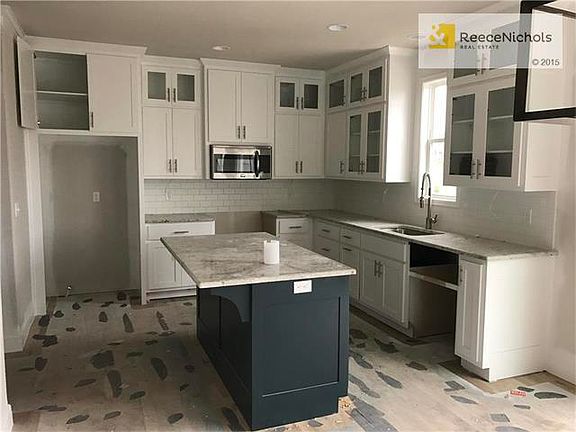 Rearranged Springbrook Kitchen, UPGrADES-extra cabinets, painted cabinets, cabinets to ceiling, glas