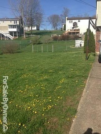 side yard
						:
						with gate big enough to take a truck, suv, riding mower in and out of back yard