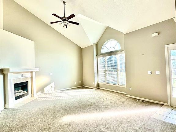 Living Room with Gas Fireplace and Vaulted Ceiling
