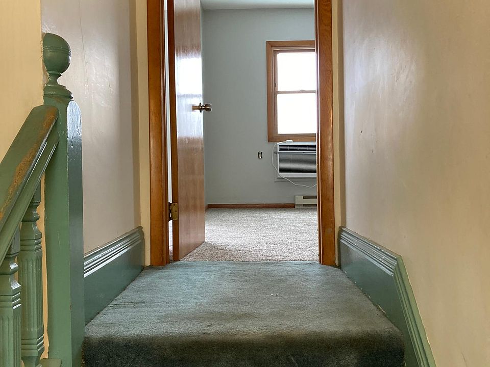 Entry hall leading up to front private entrance