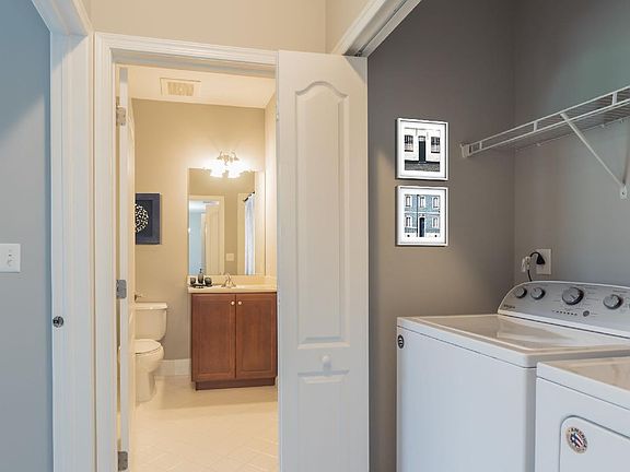 Convenient Laundry Area Near Hall Bath