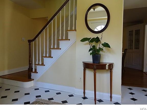 The lovely entry foyer with coat closet