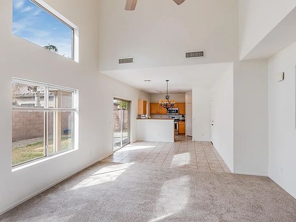 Hall, dinning area and kitchen. Please note, backyard has been remodeled and photo will be updated