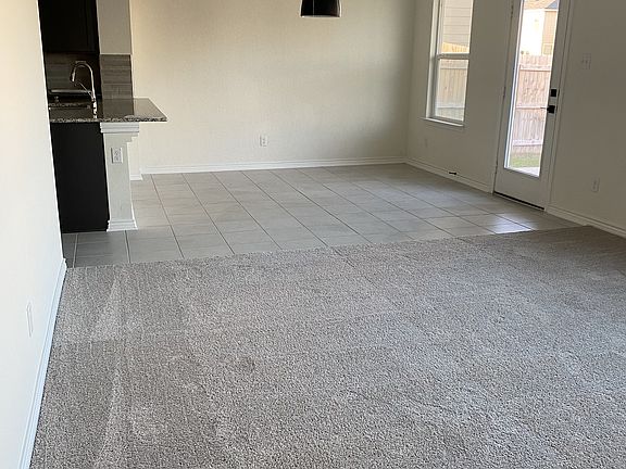 Open Concept. Kitchen can view the living and dining area. PLENTY of light. Door blinds included, and blackout blinds for every window.