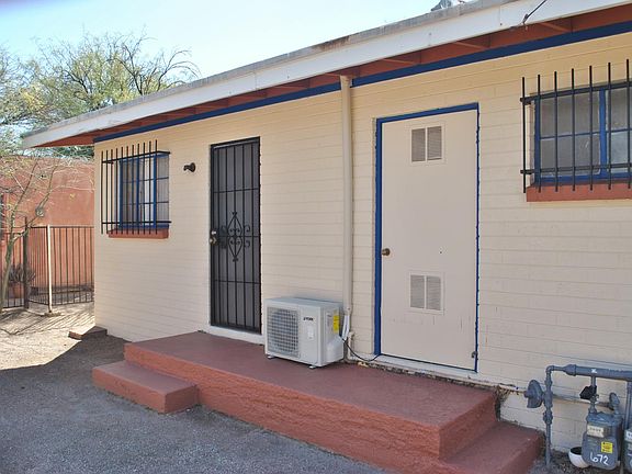 Back of the home. The yard is not fenced on all sides therefore it is not able to have dogs. It may be possible to put a laundry hookup in back if you own the washer and dryer.