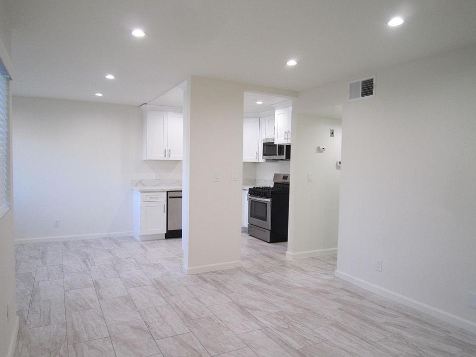 Open Living Room with recessed light s and smooth ceiling.