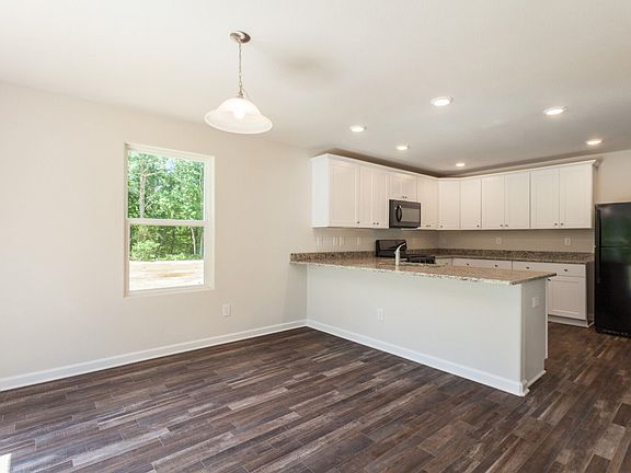 Beautiful dining nook with wood-look flooring