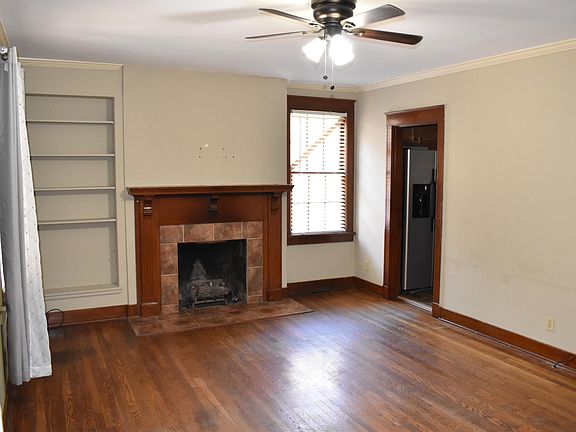 Living room with fireplace, but the fireplace is for looks only. Do not burn anything in it.