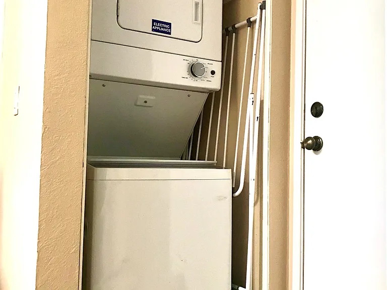 New stackable washer and dryer in unit