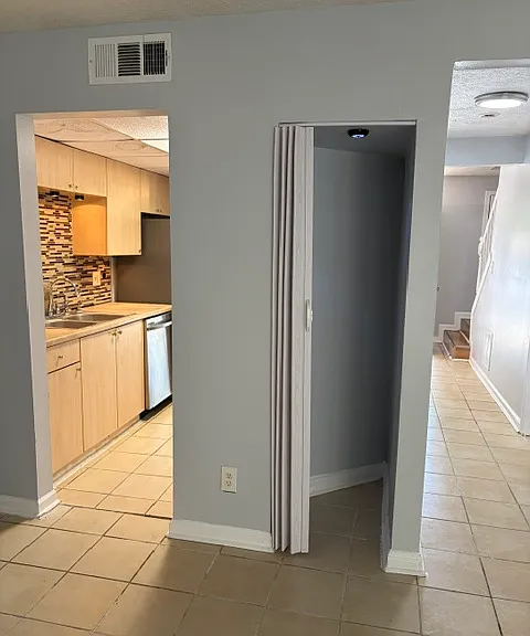 Family/living room to kitchen and hallway view