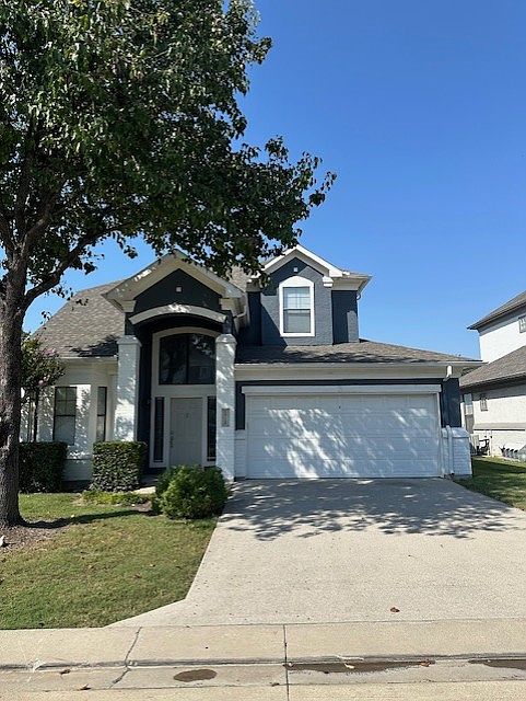 Front of home, offers 2 car garage and drive way!