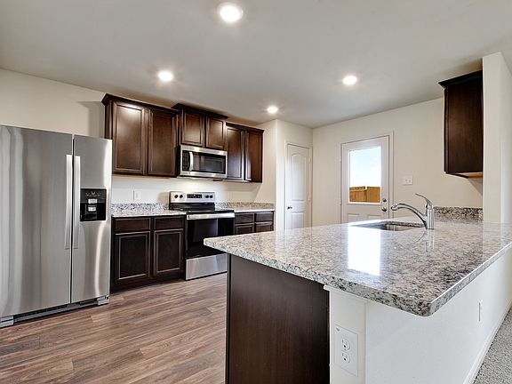 The kitchen comes with a full suite of energy-efficient appliances