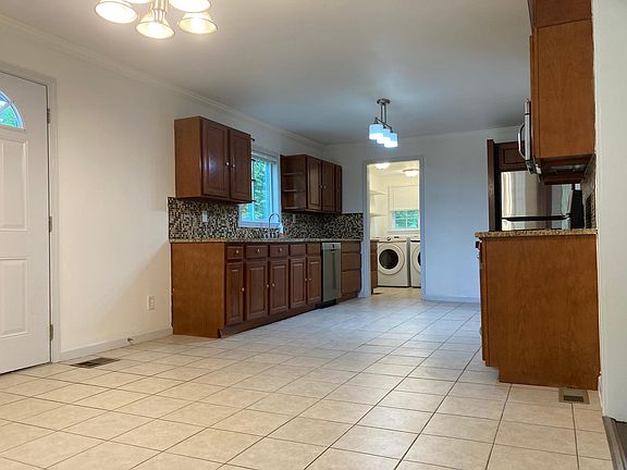 Kitchen, with laundry room in background