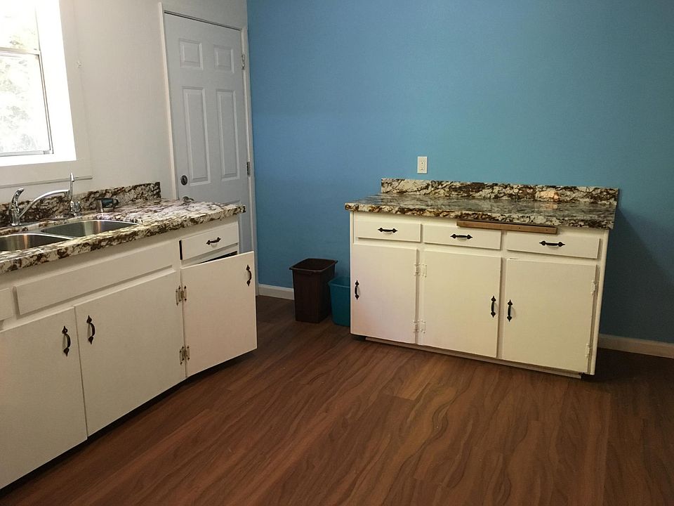 Happy kitchen with lots of countertop, cabinet, and pantry space.