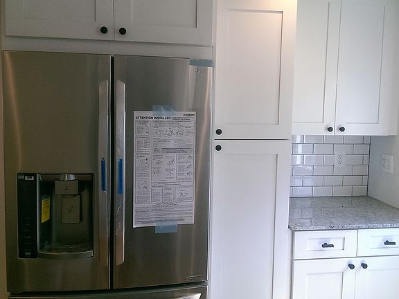 Kitchen with Pantry and Larger Fridge with ice and water