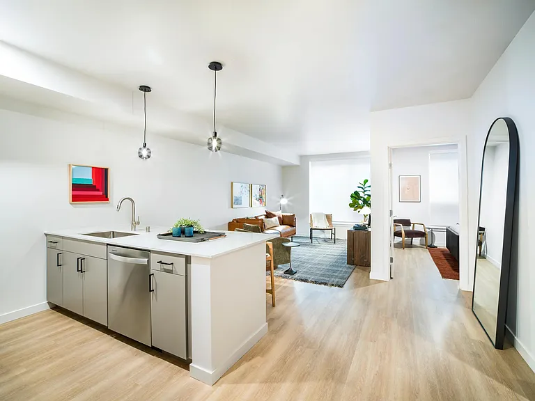Open-concept living at Modera Shoreline blends sleek design with comfort, offering a bright and versatile space ideal for gatherings or quiet evenings in.
