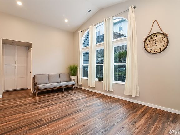 Another View of Living Room from Dining Room & Access to Master Suite.  Extensive & Durable Laminate Wood Floors - Attractive Color Compliments all Decor!