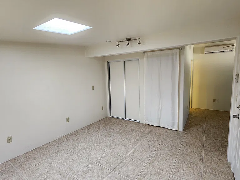 Bedroom with New Stack Washer/Dryer, Behind Curtain