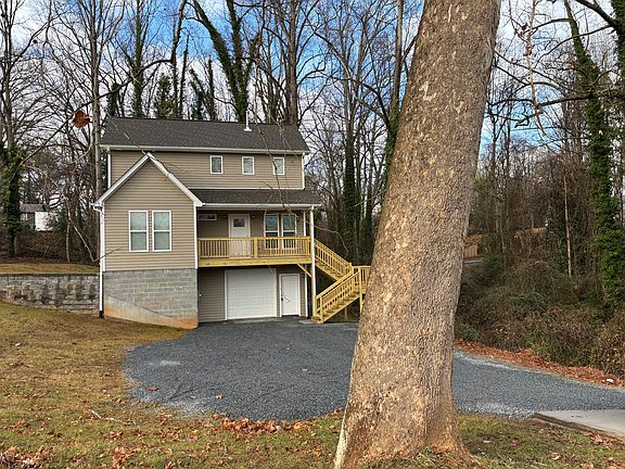 Set back from the street with plenty of off street parking and a wooded buffer on the right side. Oversized one car garage and huge storage room/workshop. Fence just added!