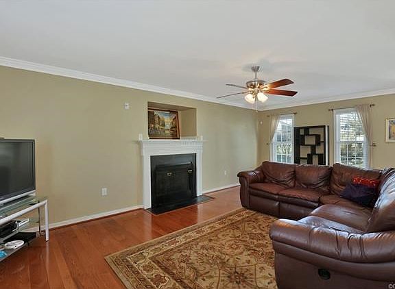 Fireplace with beautiful wood surround mantel, ceiling fan, wired for surround sound