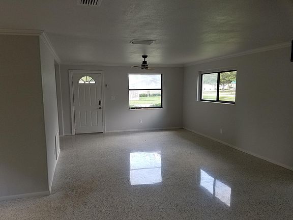 Spacious open living and dining room with beautifully refinished terrazzo floors...no carpet.....