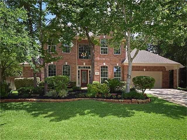 Two Story Brick Emerald Home with Attached 3 Car Tandem Garage. Lush Landscape Greets You As You Dri