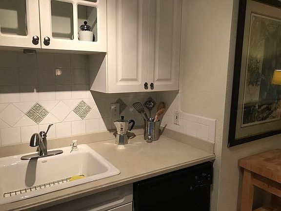 Kitchen partial view of countertop and butcher block.