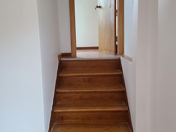 Stairs to the upstairs' room. This could be either the office, playroom, or bedroom.