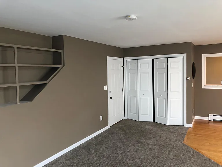 Laundry closet with washer and dryer. Entrance door