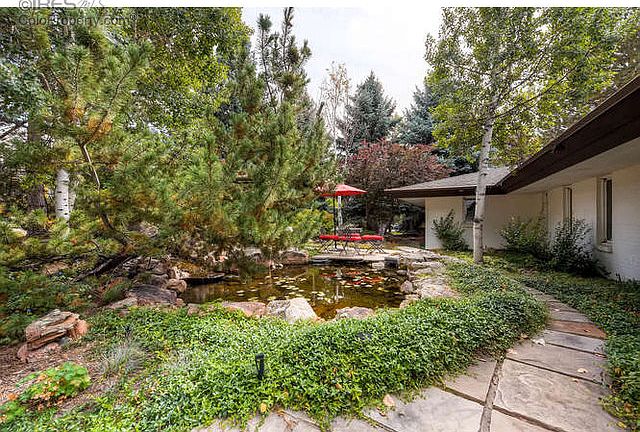 Gorgeous Landscaping at Entry w/ Koi Pond