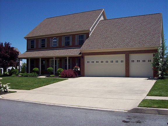All Brick Front + 9' Garage Doors