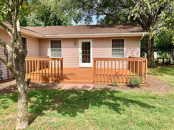 LARGE WOODEN DECK FRESHLY STAINED