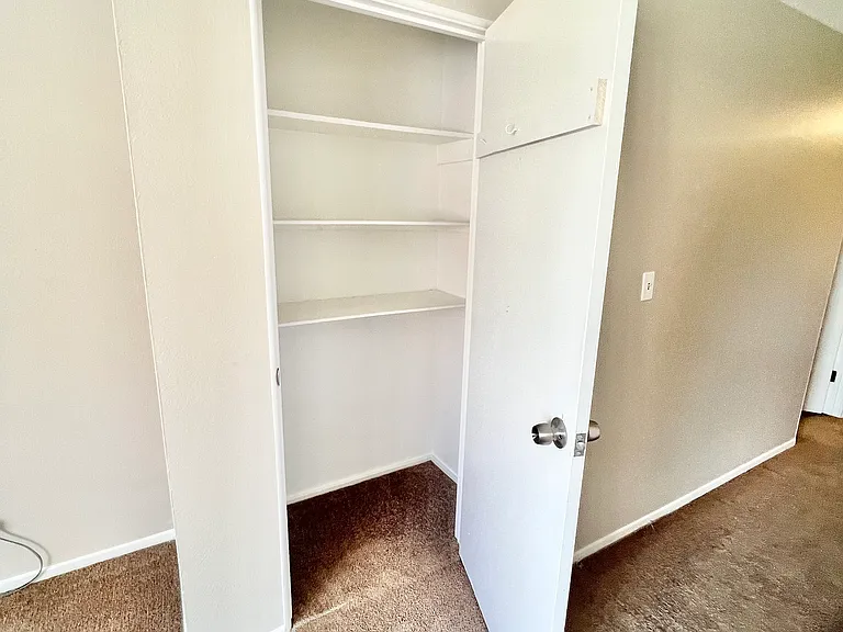 Explore the ample storage space with this elegant closet design. Explore the ample storage space with this elegant closet design.