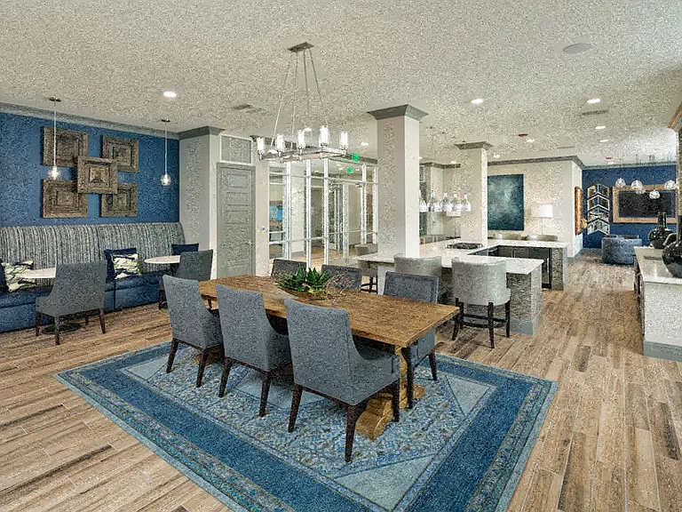 Resident lounge with demonstration kitchen and dining room table
