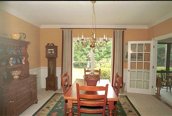 Separate Dining Room with real raised-panel wainscotting, chair rail, crown, e